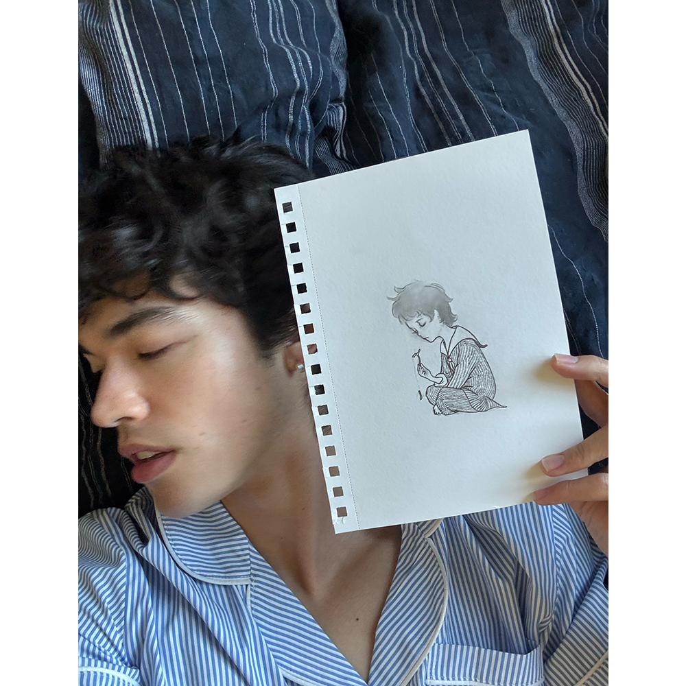 Wishbone CD (featuring illustration by Conan) - Conan Gray holding sketch 2